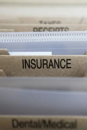 A file folder labeled Insurance
