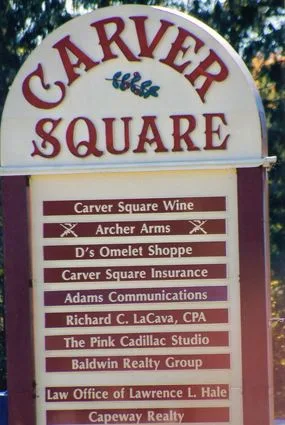 The Carver Square marketplace sign listing Carver Square Insurance