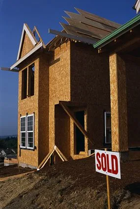 A new home with a sold sign